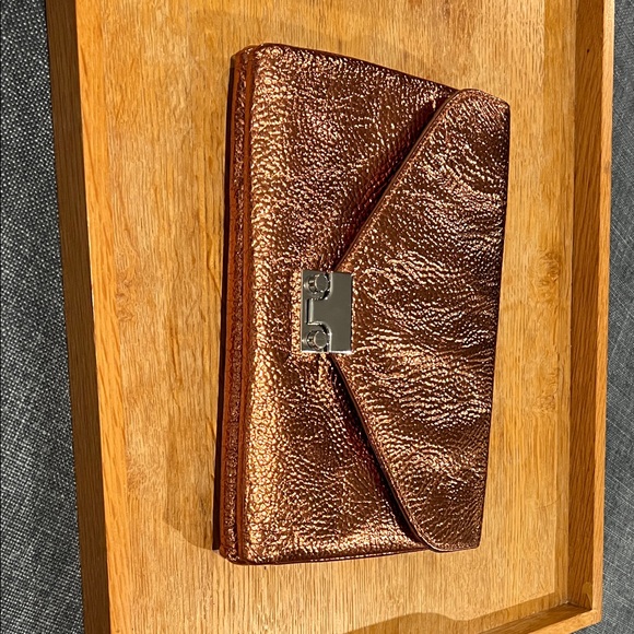 Loeffler Randall Lock Clutch NWOT, Copper